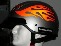 Reflective orange flame decals on side of half helmet.  Helmet flame decals are bright and contrasting on a silver helmet.