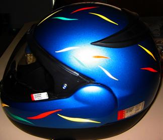 Colored individual reflective flame helmets installed on a full face helmet.
